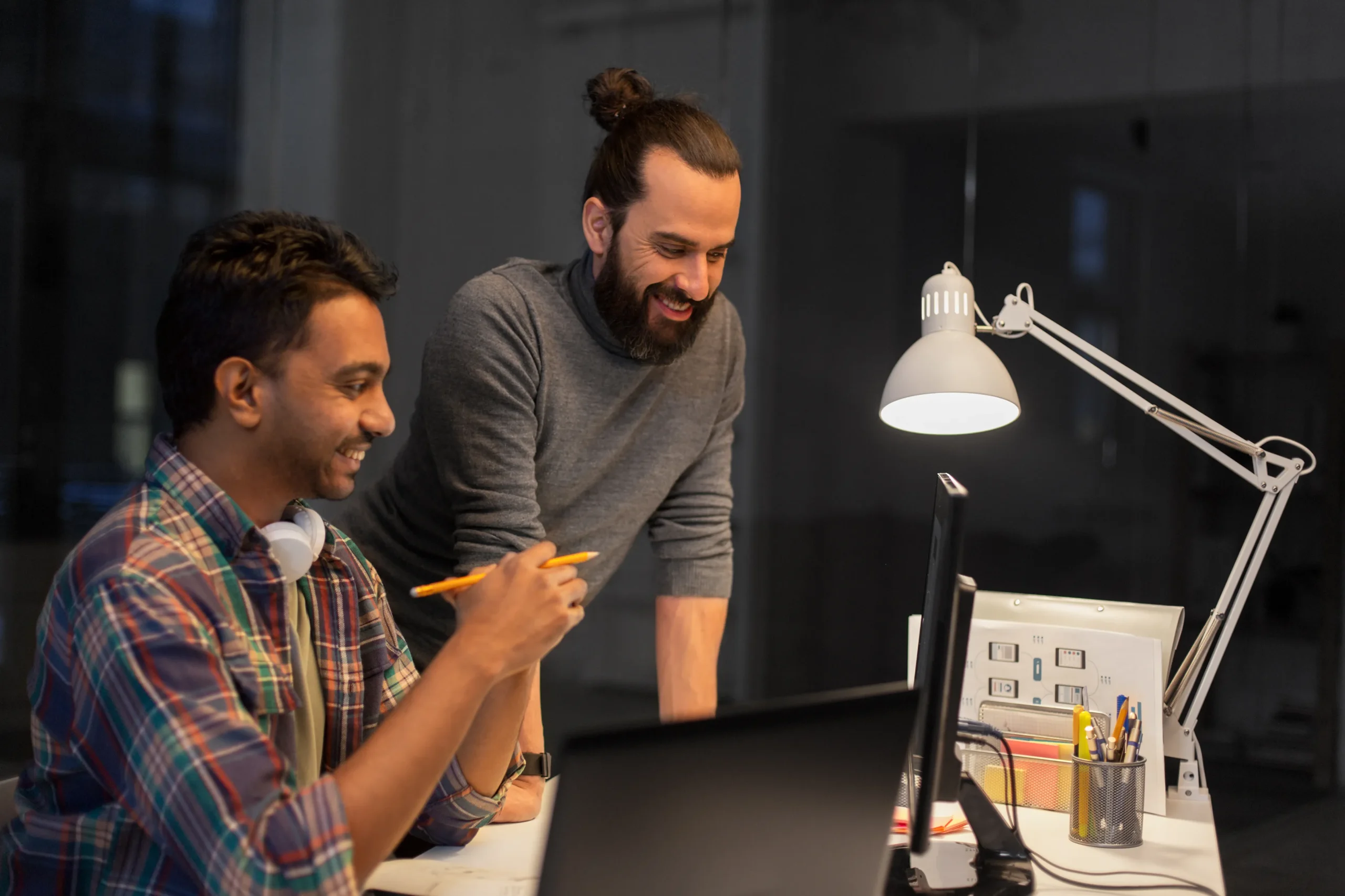 creative team with computer working late office scaled